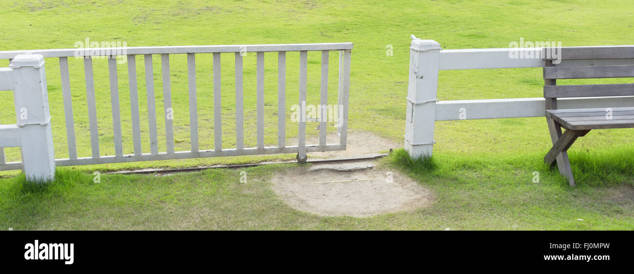 white fence and green grass Stock Photo