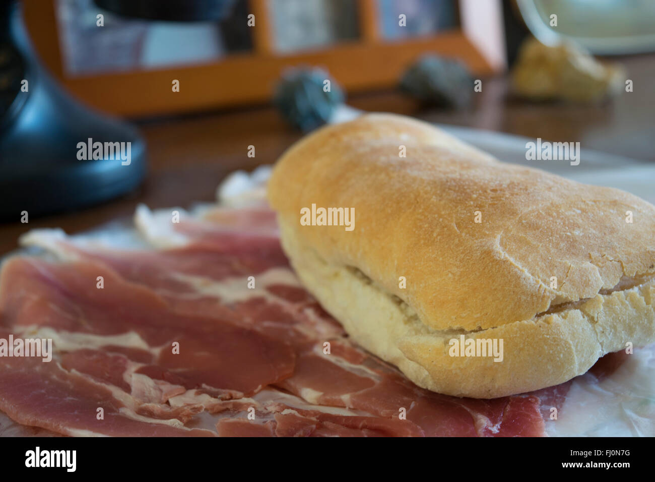 crispy sandwich and raw ham for a filled roll Stock Photo