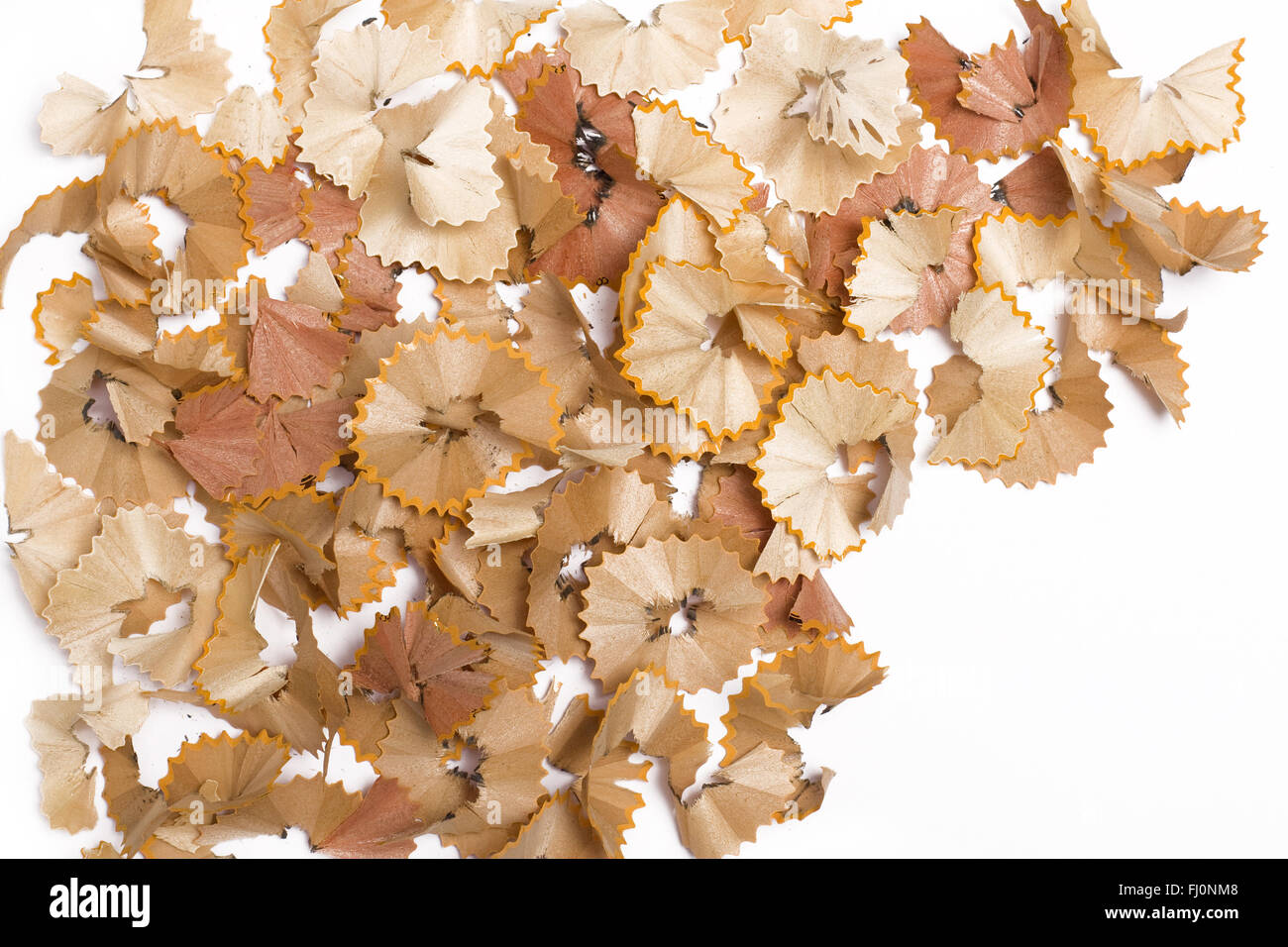 Horizontal top view of wood remains from sharpening pencils isolated on white background Stock Photo