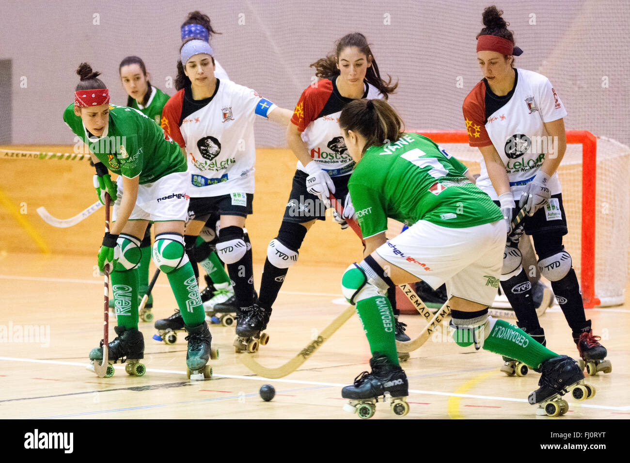 Gijon, Spain. 27th February, 2016. Vanessa Garcia (Cerdanyola) prepares to take a shot covered by Hostelcur Gijon's player during the roller hockey match of Spanish Women's OK League between Hostelcur Gijon HC and Cerdanyola CH at MataJove Center on February 27, 2016 in Gijon, Spain. Credit:  David Gato/Alamy Live News Stock Photo