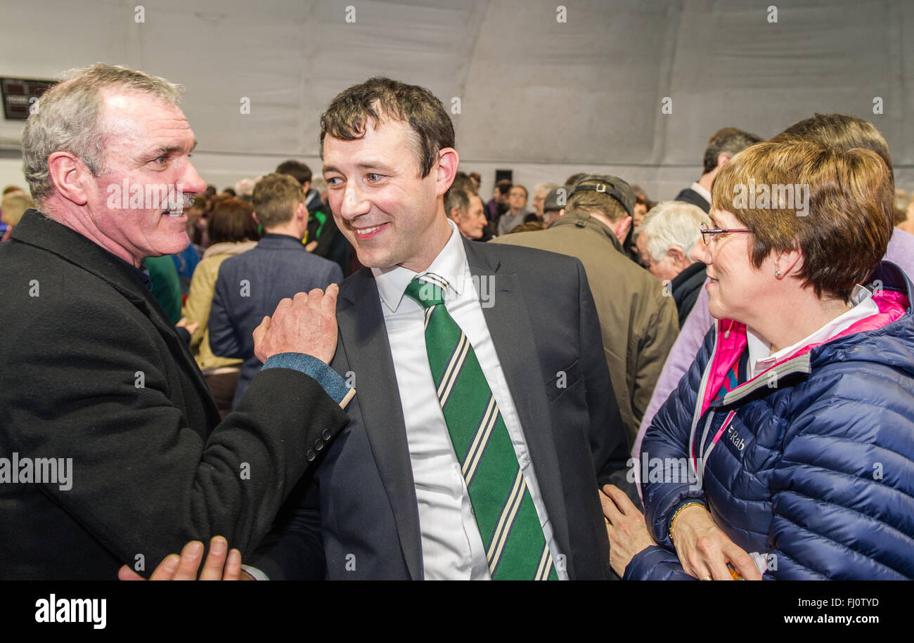 Ballincollig, Ireland. 27th February, 2016. Fianna Fáil Candidate Aindrias Moynihan celebrates with colleagues and friends after the first count put him 55 votes ahead of Fine Gael Candidate, Michael Creed in the Cork North West constituency in the 2016 Irish General Election. The count was held at Coláiste Choilm in Ballincollig, Co. Cork, Ireland. Credit: AG News/Alamy Live News Stock Photo
