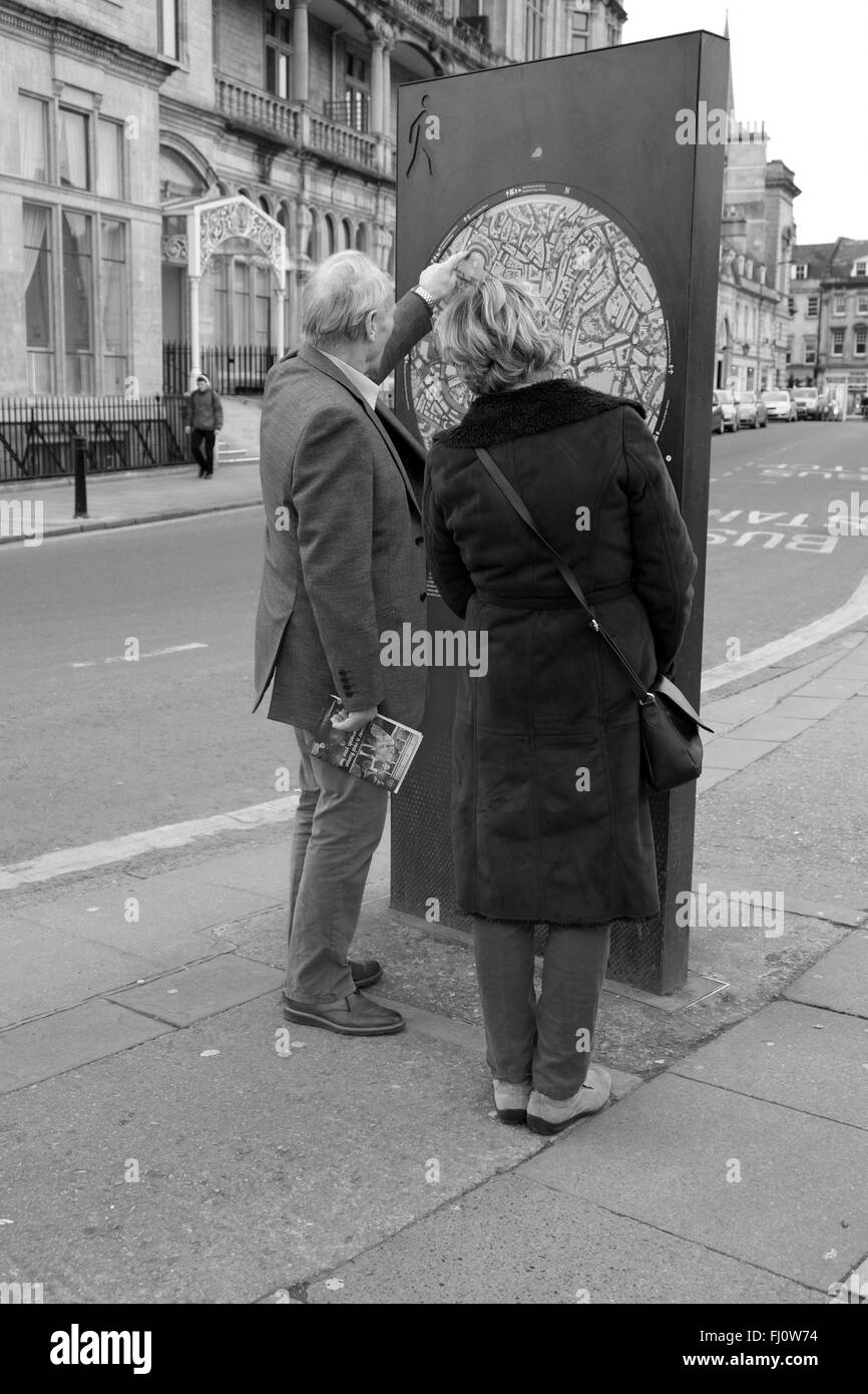 Mature couple reading a public street in the city of Bath, 26th February 2016 Stock Photo