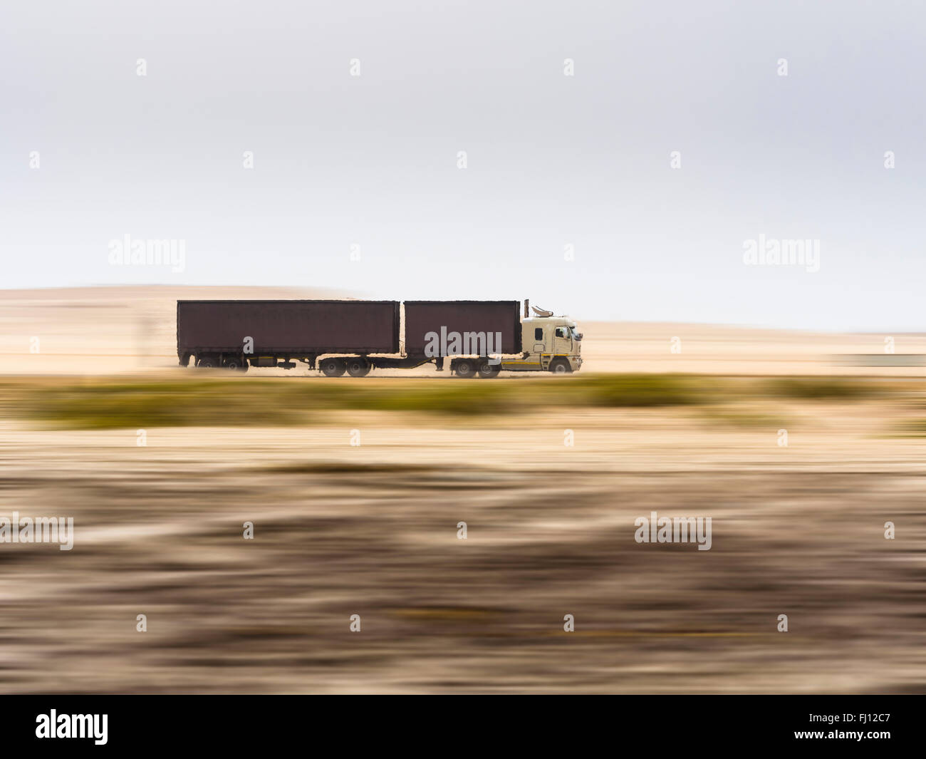 Namibia, Erongo, truck drivin fast on coastal road C34 Stock Photo