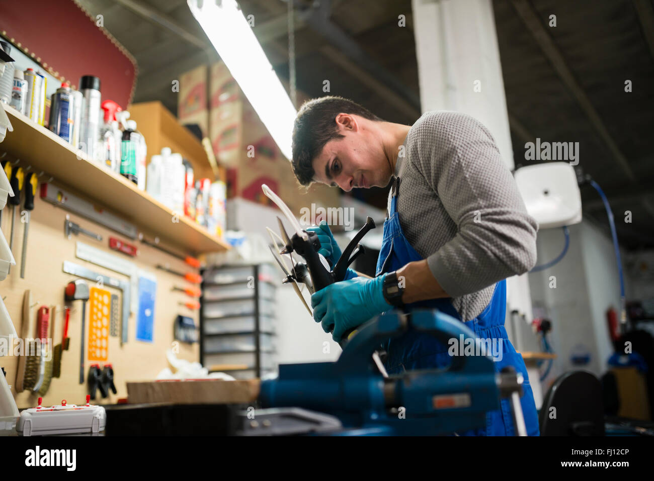 Mechanic repairing a drone in his workshop Stock Photo