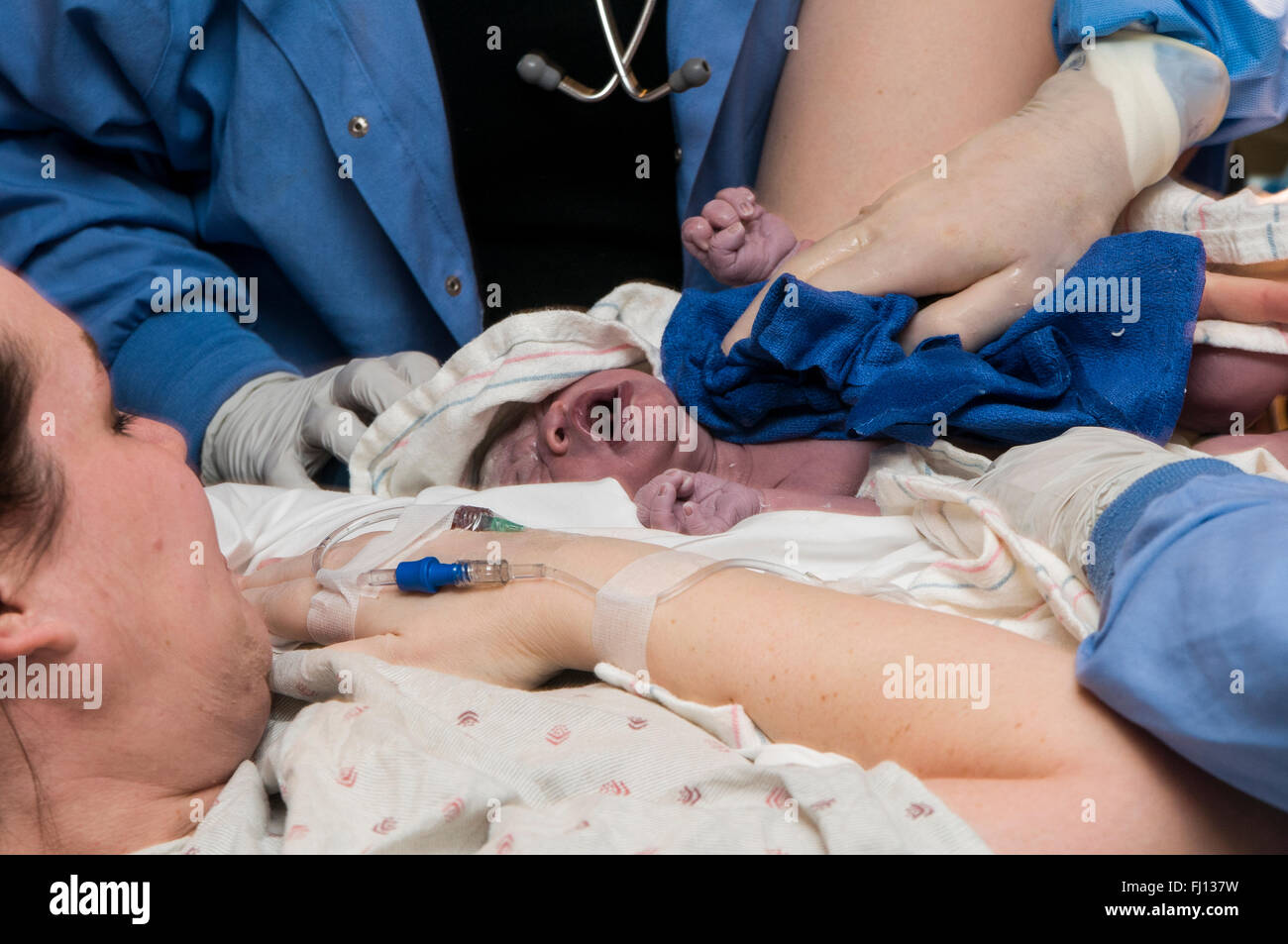 Fridley, Minnesota. Unity hospital. 31 year old single mom having a newborn bi-racial baby girl in the hospital. Stock Photo