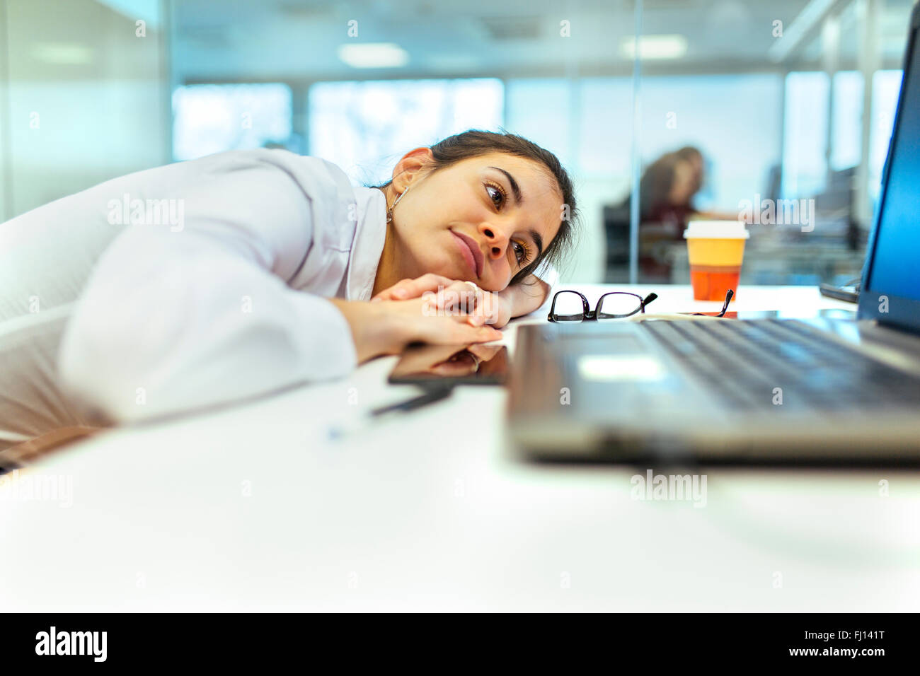 Young Woman Boring At Her Desk In An Office Stock Photo 97140788
