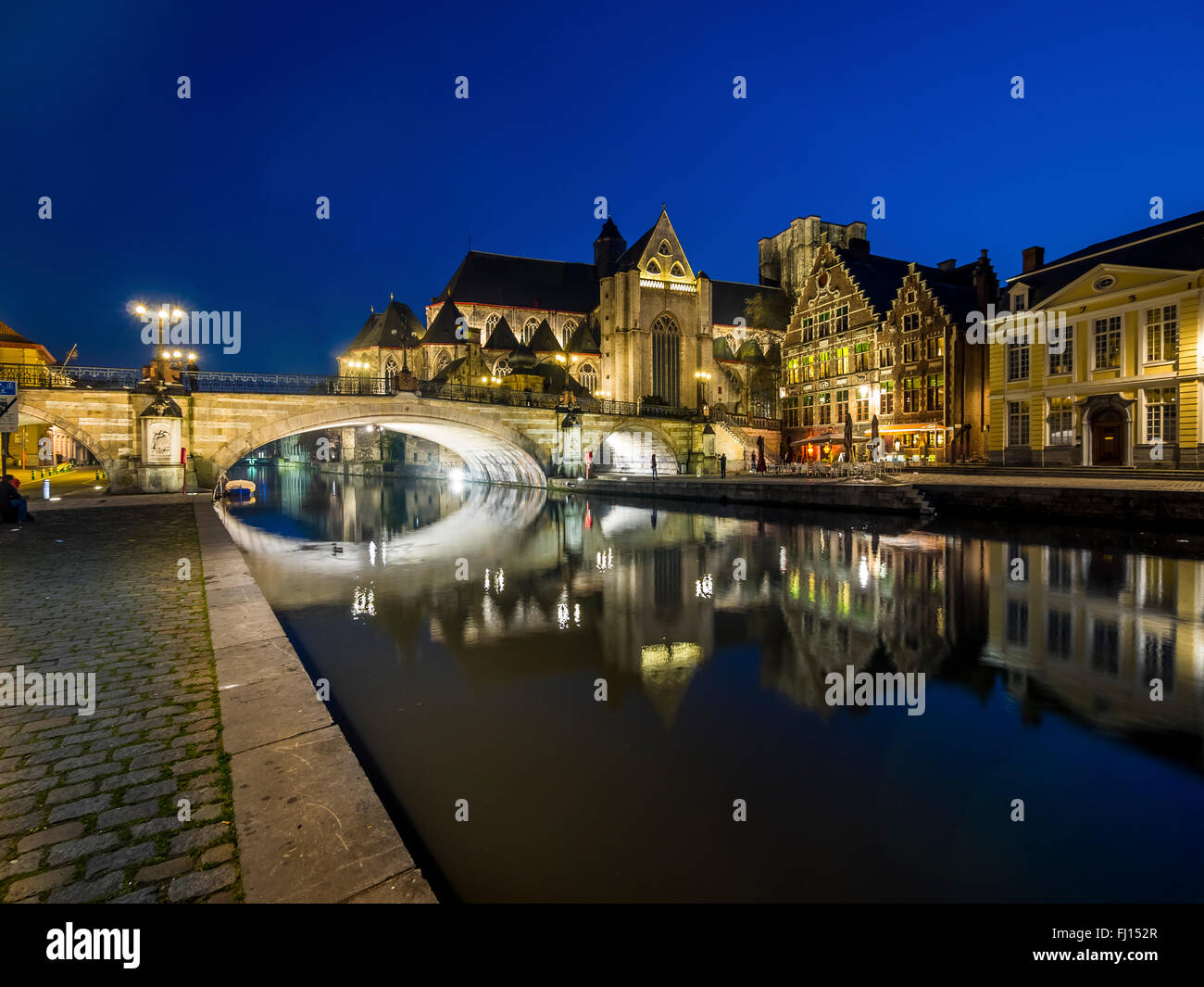 Belgium, Ghent, Korenlei and Graslei with St. Nicholas' Church and St. Michael Bridge at night Stock Photo