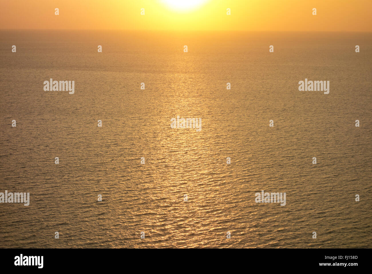 golden sunset over ocean Stock Photo - Alamy