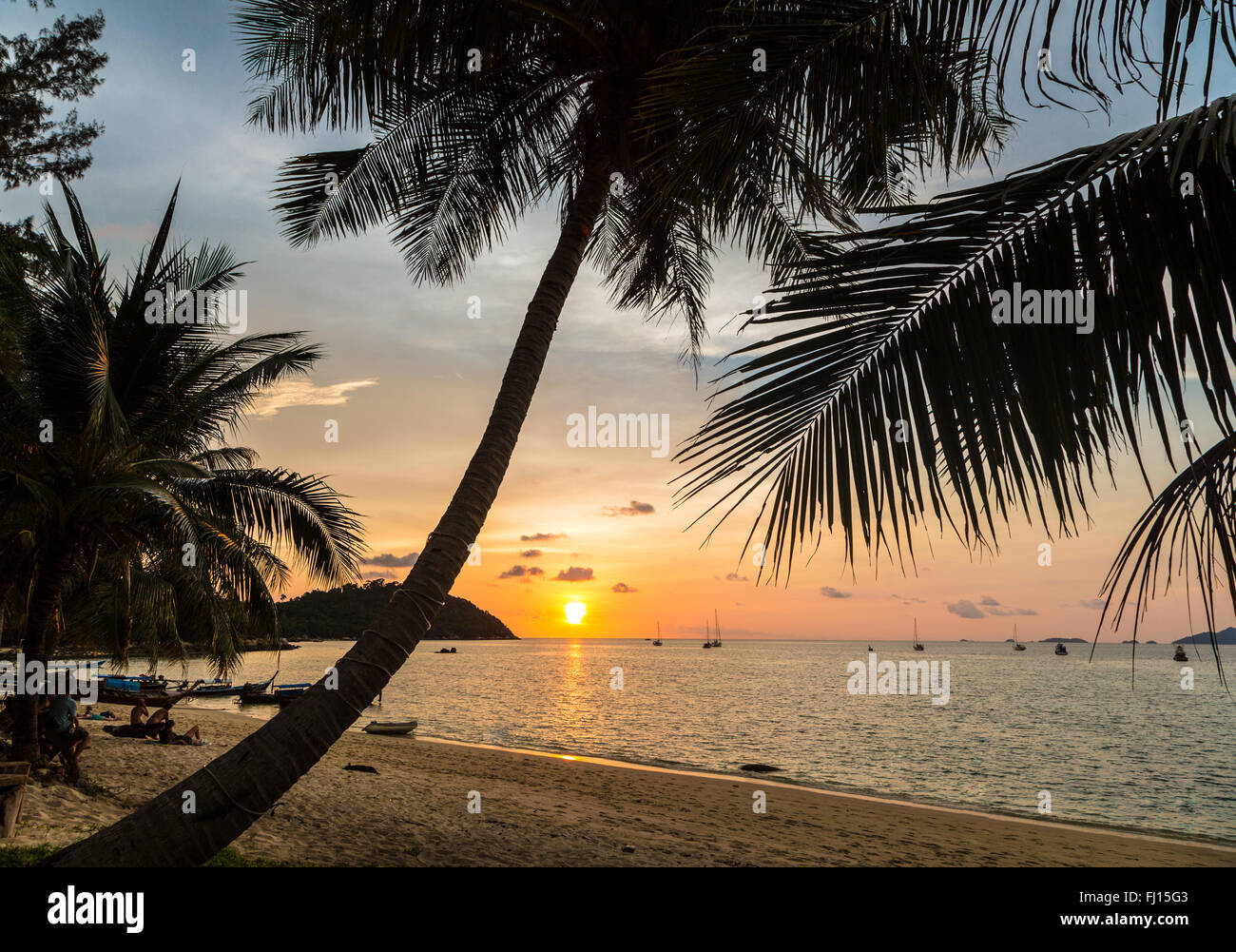 Sunset over a lonely beach in Koh Lipe island in the Andaman sea in south Thailand. Stock Photo