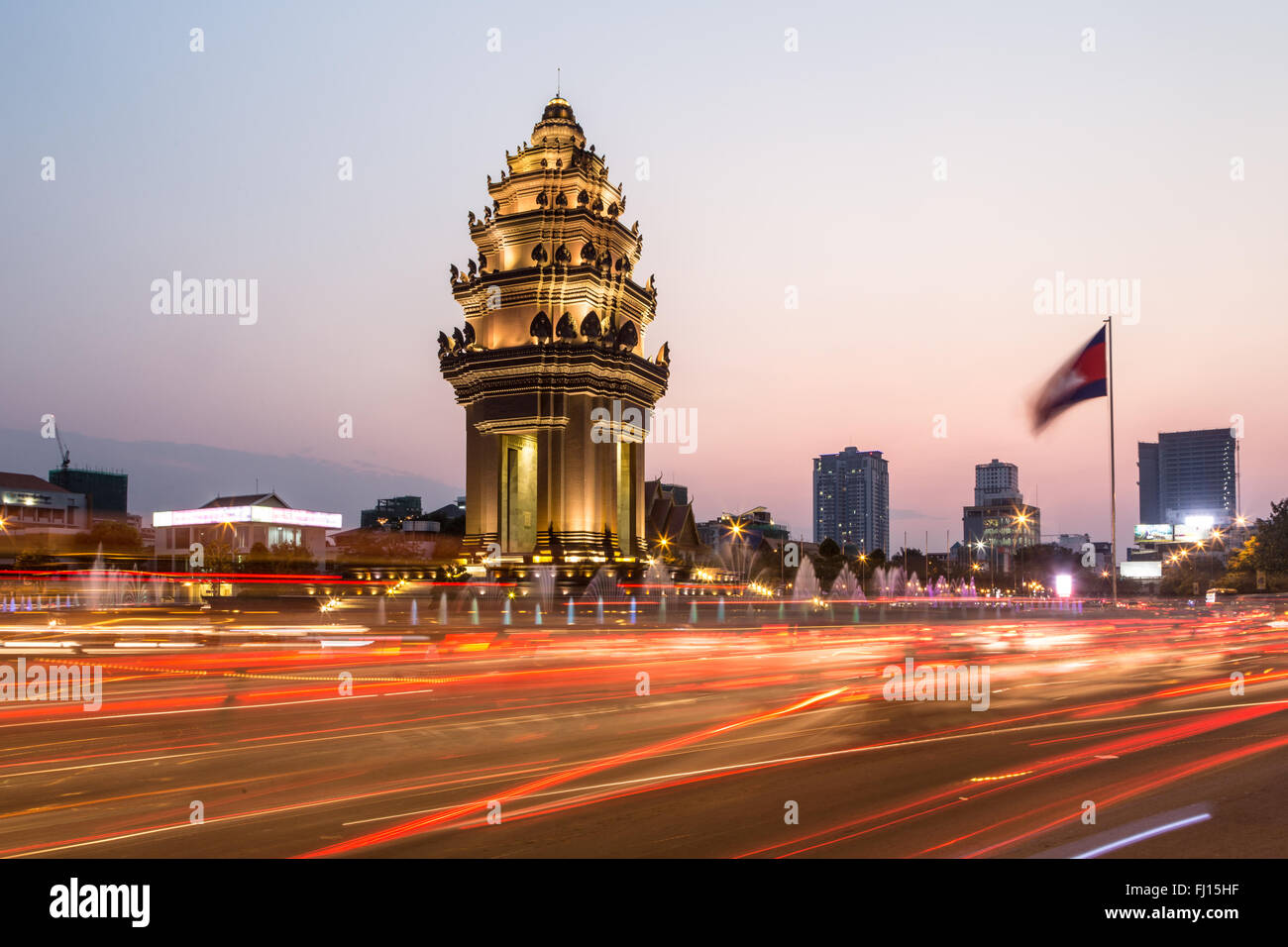 Traffic rush around the Independence monument, with its Khmer architecture style, in Phnom Penh, Cambodia capital city. Blurred Stock Photo