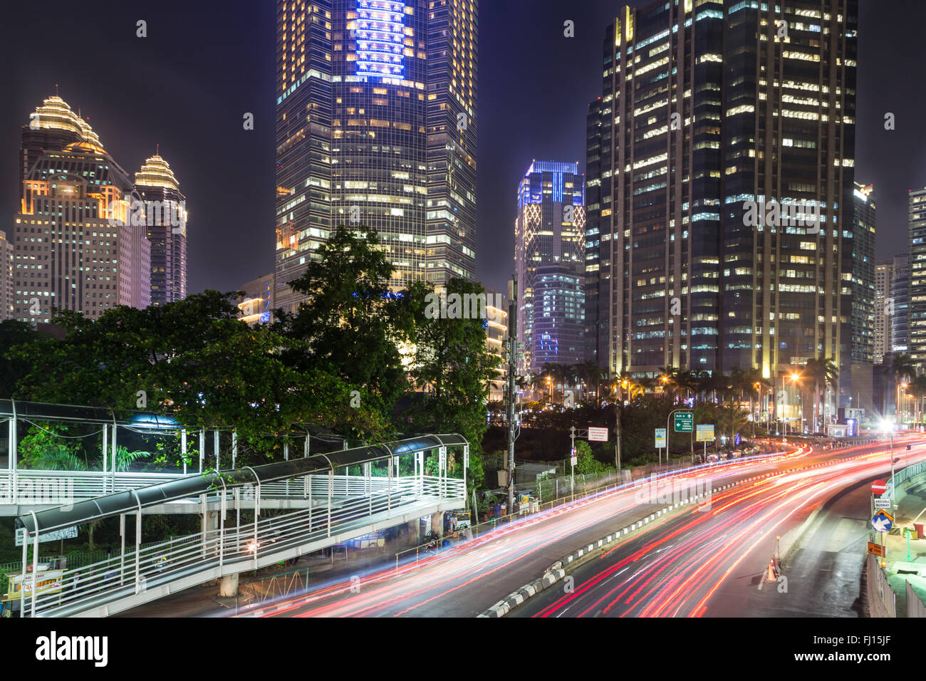 Traffic at night in Jakarta, along Indonesia capital city main avenue