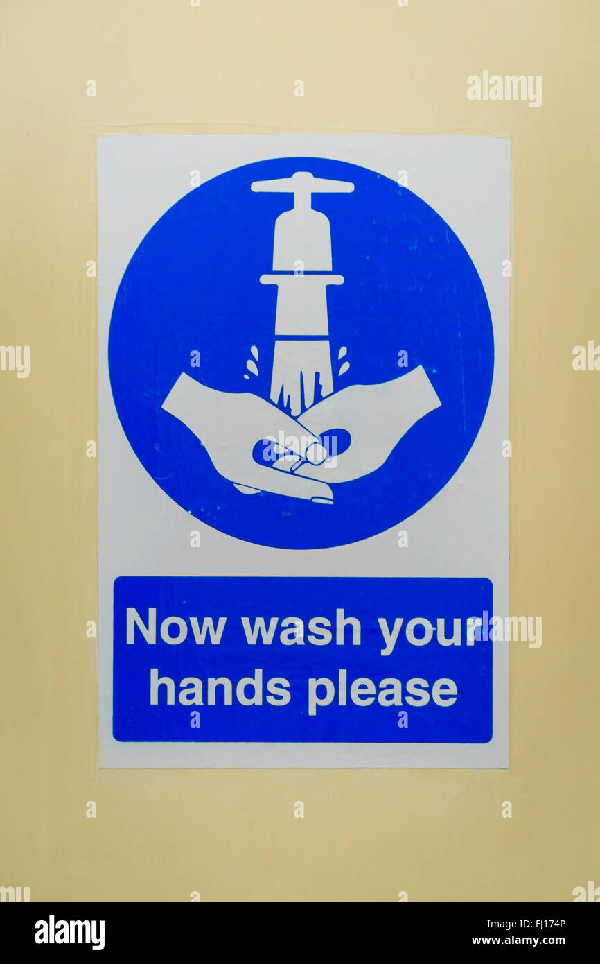Sign notice Now Wash Your Hands Please Stock Photo