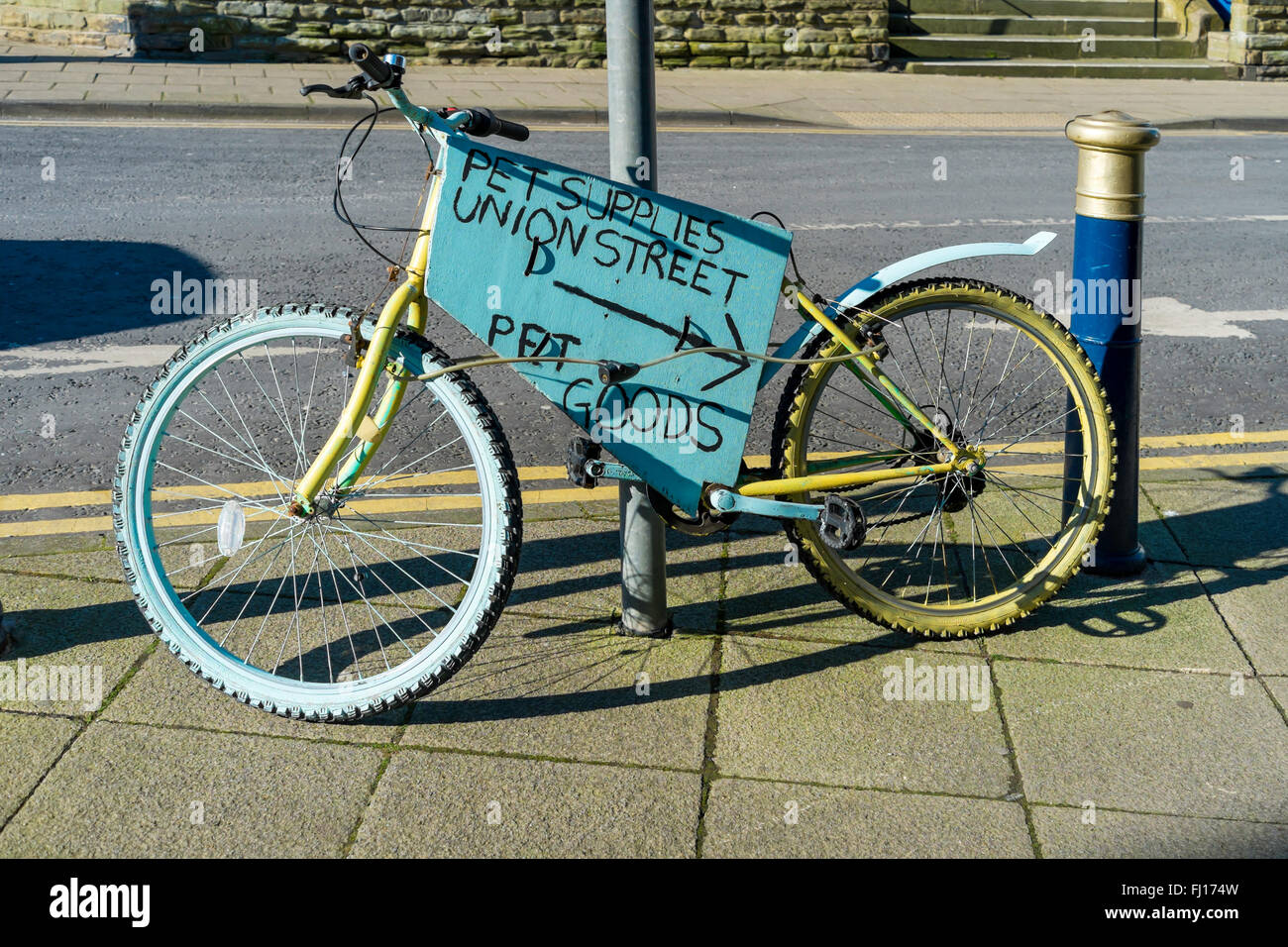 A  bicycle decorated for promoting Pet Supplies in Union Street Filey Sea North Yorkshire Stock Photo