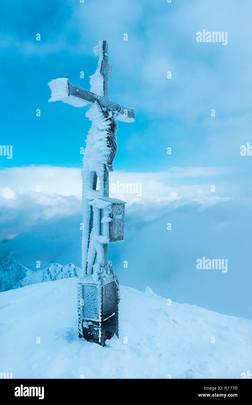 Austria, Salzburg State, summit cross on Sonntagshorn in winter Stock Photo