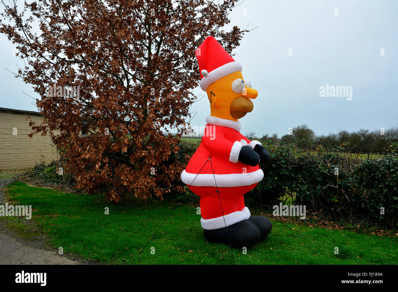 Homer Simpson as Santa inflatable outside a house in Warwickshire. Stock Photo