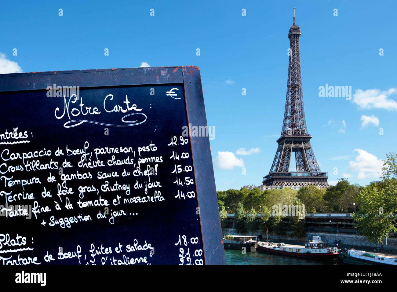 Paris restaurant menu board, Eiffel Tower and river seine boats Stock Photo