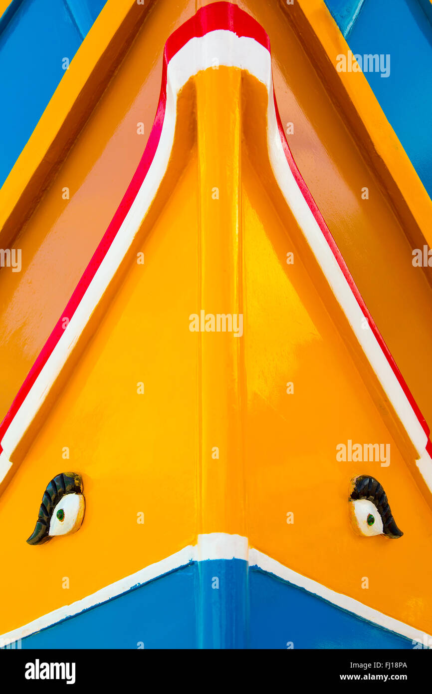 Abstract close up view of the vibrant colours and design usually used on the traditional Maltese fishing boat, the 'Dghajsa' or  Stock Photo
