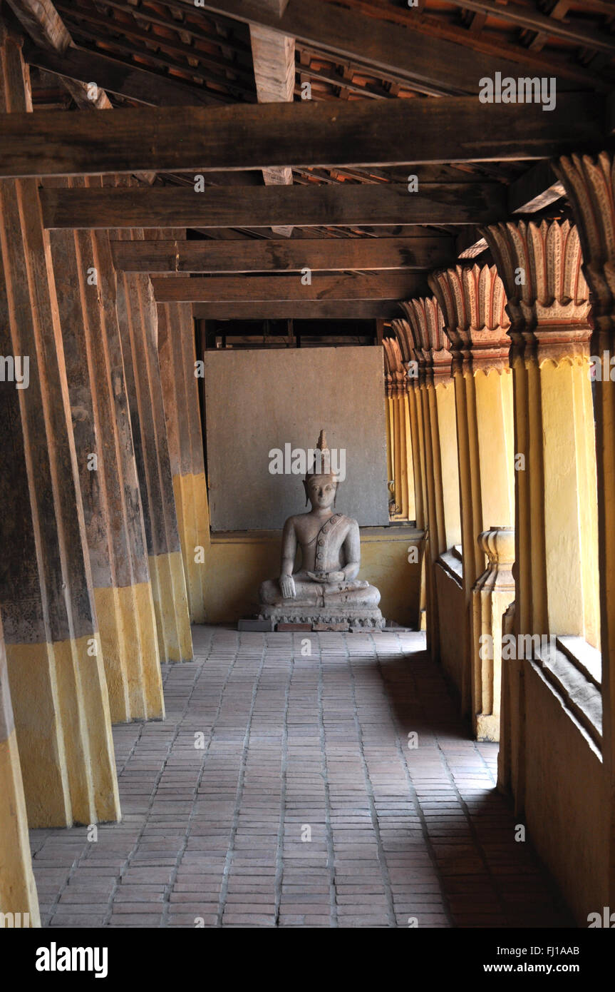 Buddha statue in a corridor at Wat Sisaket monastery and museum. Vientiane, Laos Stock Photo