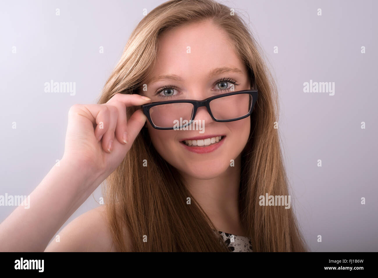 Attractive teenage girl wearing spectacles with a black frame Stock Photo