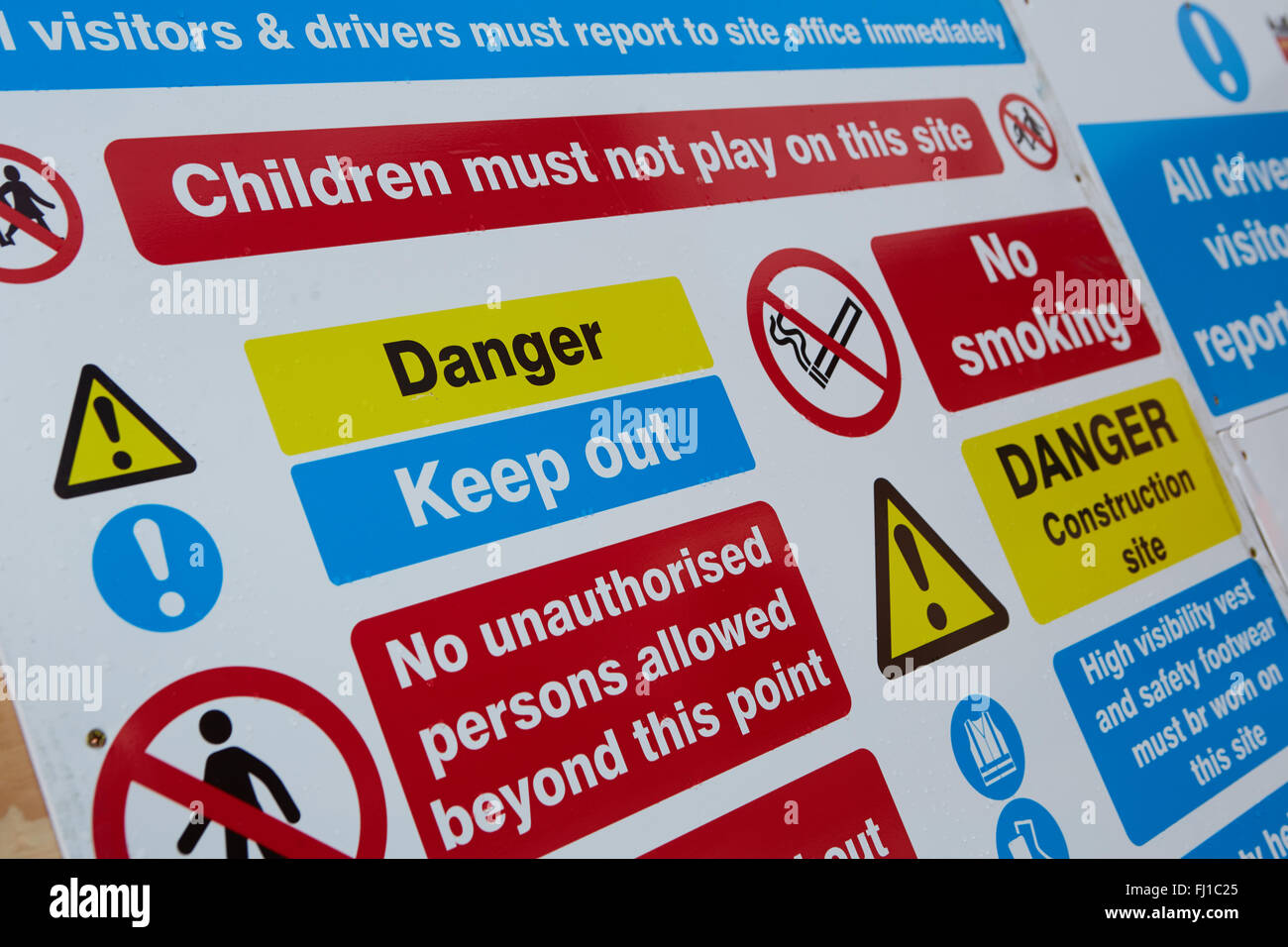 Building site health and safety signs   Signage boards information notices warnings no smoking danger keep out no unauthorised Stock Photo