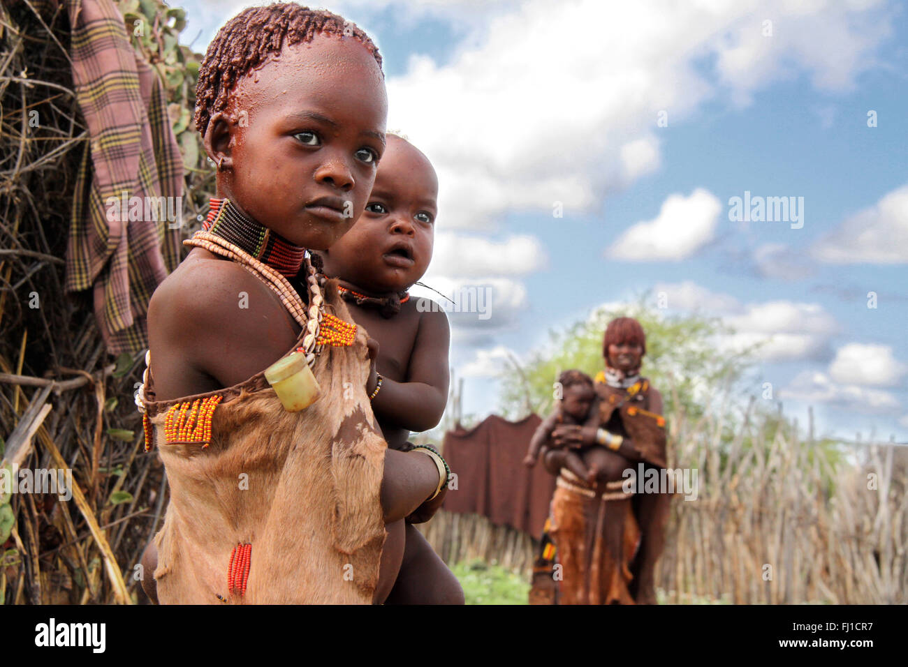 Portrait of hamer hamar young girl with her younger brother near Turmi, Omo valley , Ethiopia Stock Photo