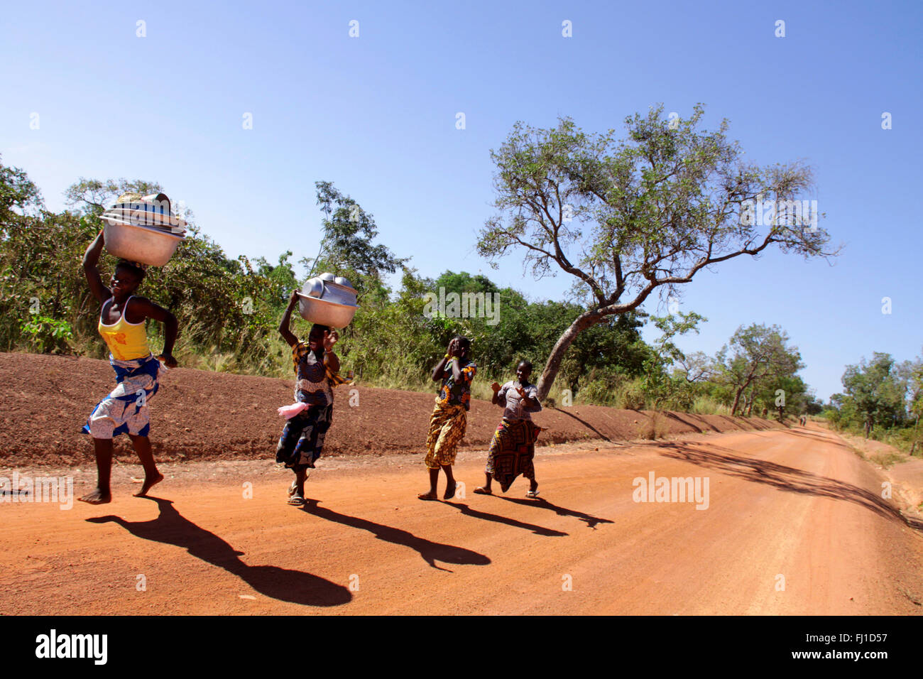 A group of girls are happy and dancing along the road near Bobo Dioulasso , Burkia Faso , West Africa Stock Photo