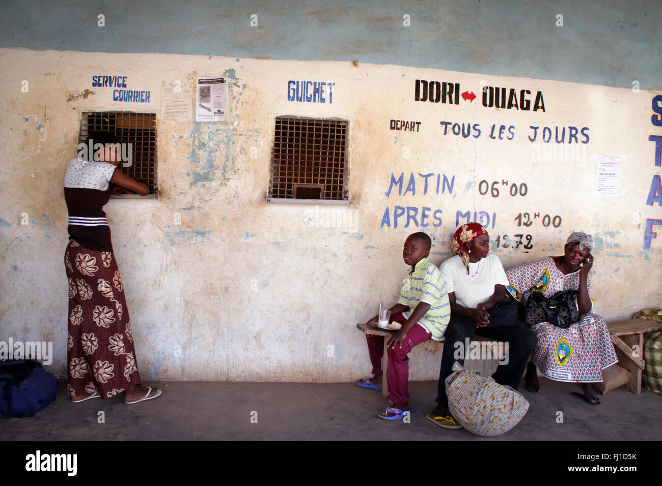 people waiting at bus stand in Dori , Burkina Faso Stock Photo