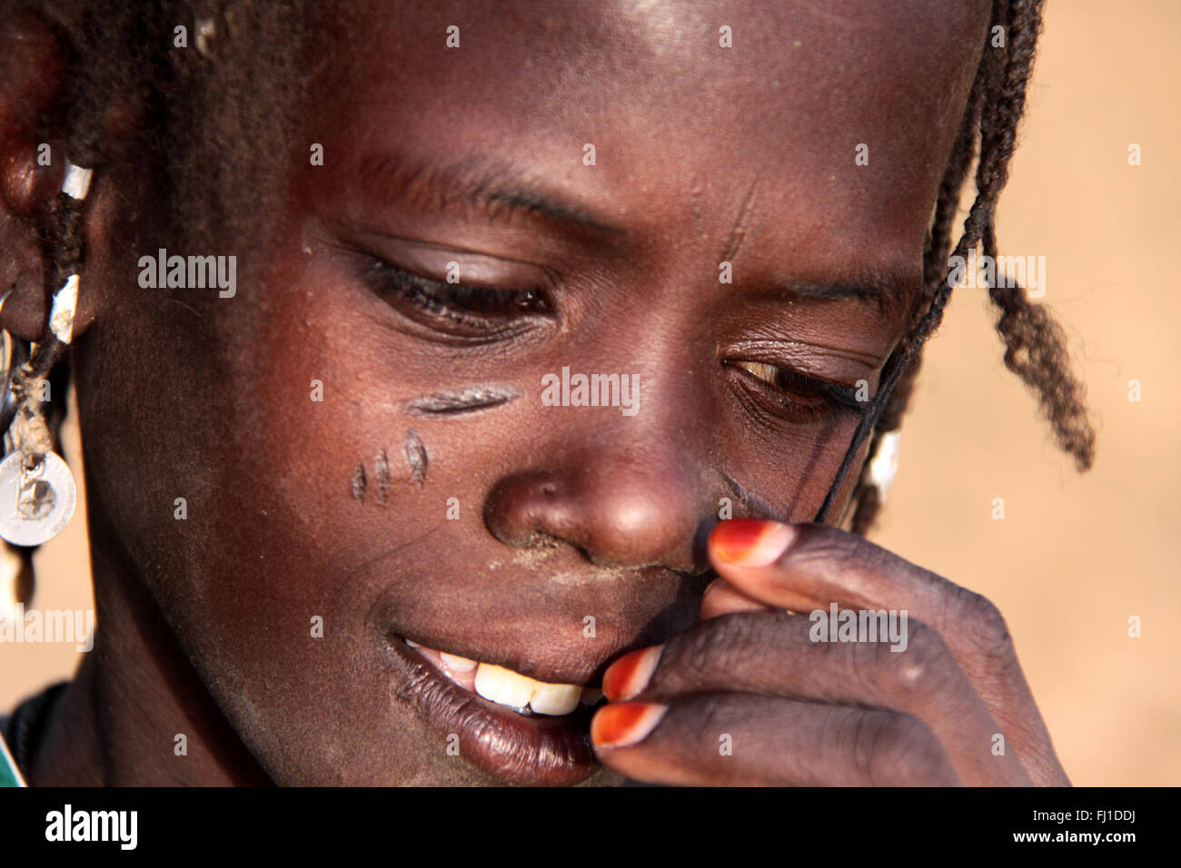 Portrait of fulani girl with scarification scarring in Gorom Gorom Burkina Faso Stock Photo