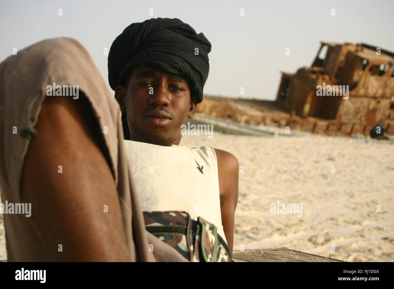 Black man on the beach and traditional harbor of Nouakchott , Mauritania Stock Photo