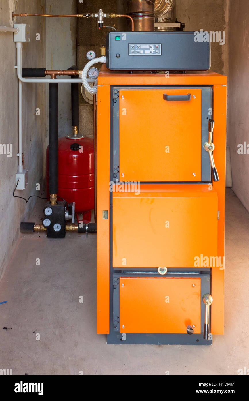 Firewood boiler in the boiler room Stock Photo Alamy