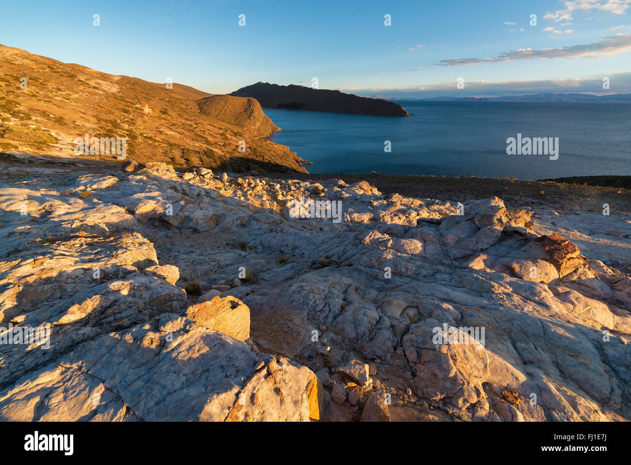 Sunset light on the Island of the Sun, Titicaca Lake, among the most scenic travel destination in Bolivia. Expansive panorama wi Stock Photo