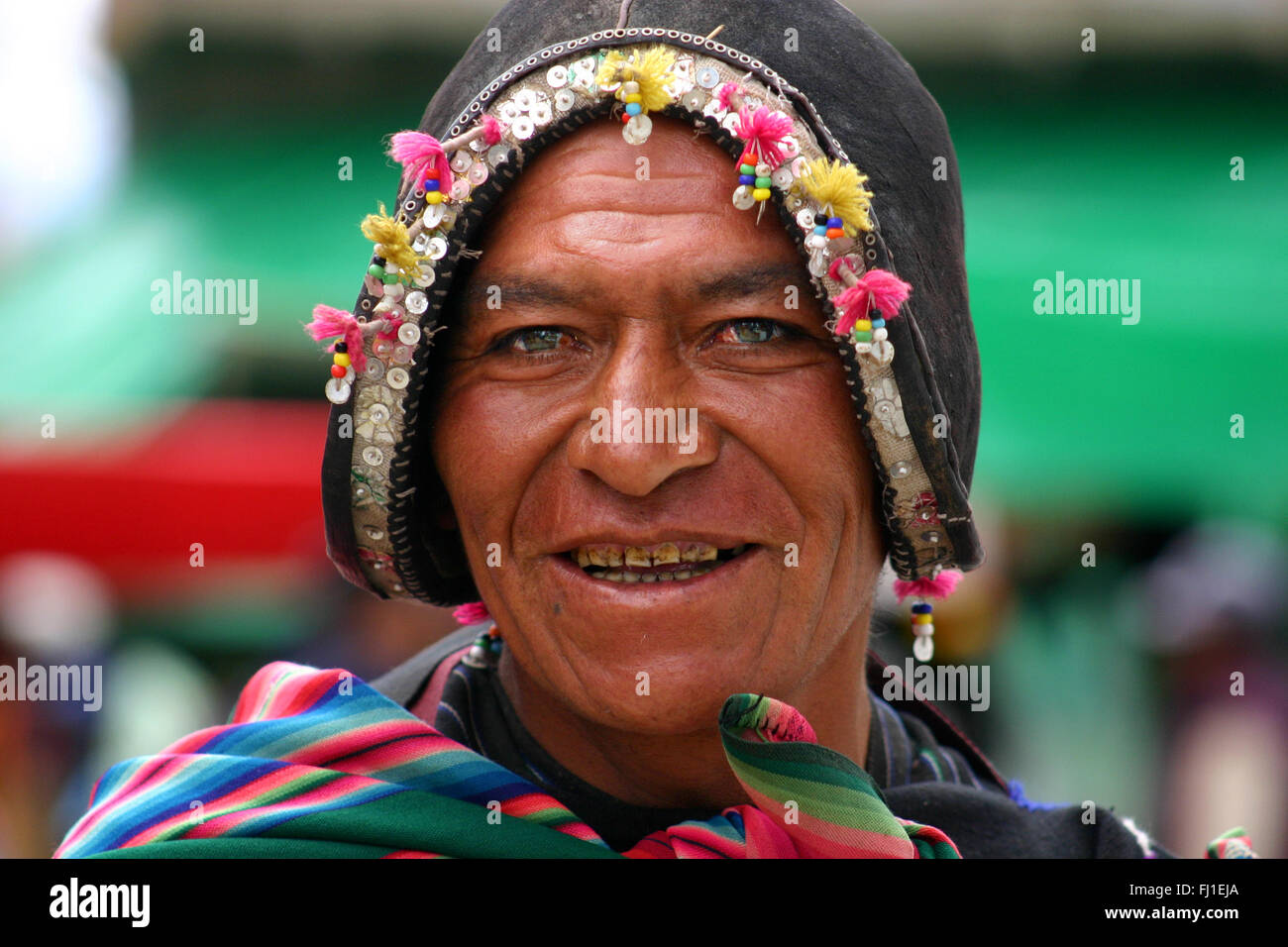Man wearing traditional Spanish conquistadors helmet in Tarabuco,market Bolivia Stock Photo