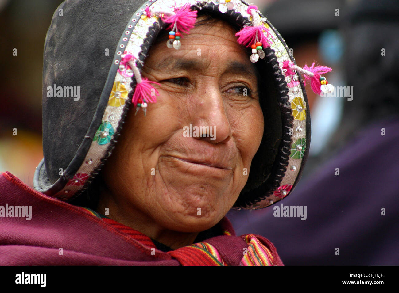 Woman with traditional Spanish conquistadors helmet in Tarabuco, Bolivia Stock Photo