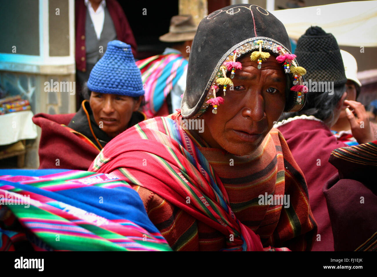 Man in Tarabuco market wearing Spanish conquistadors helmet, Bolivia Stock Photo