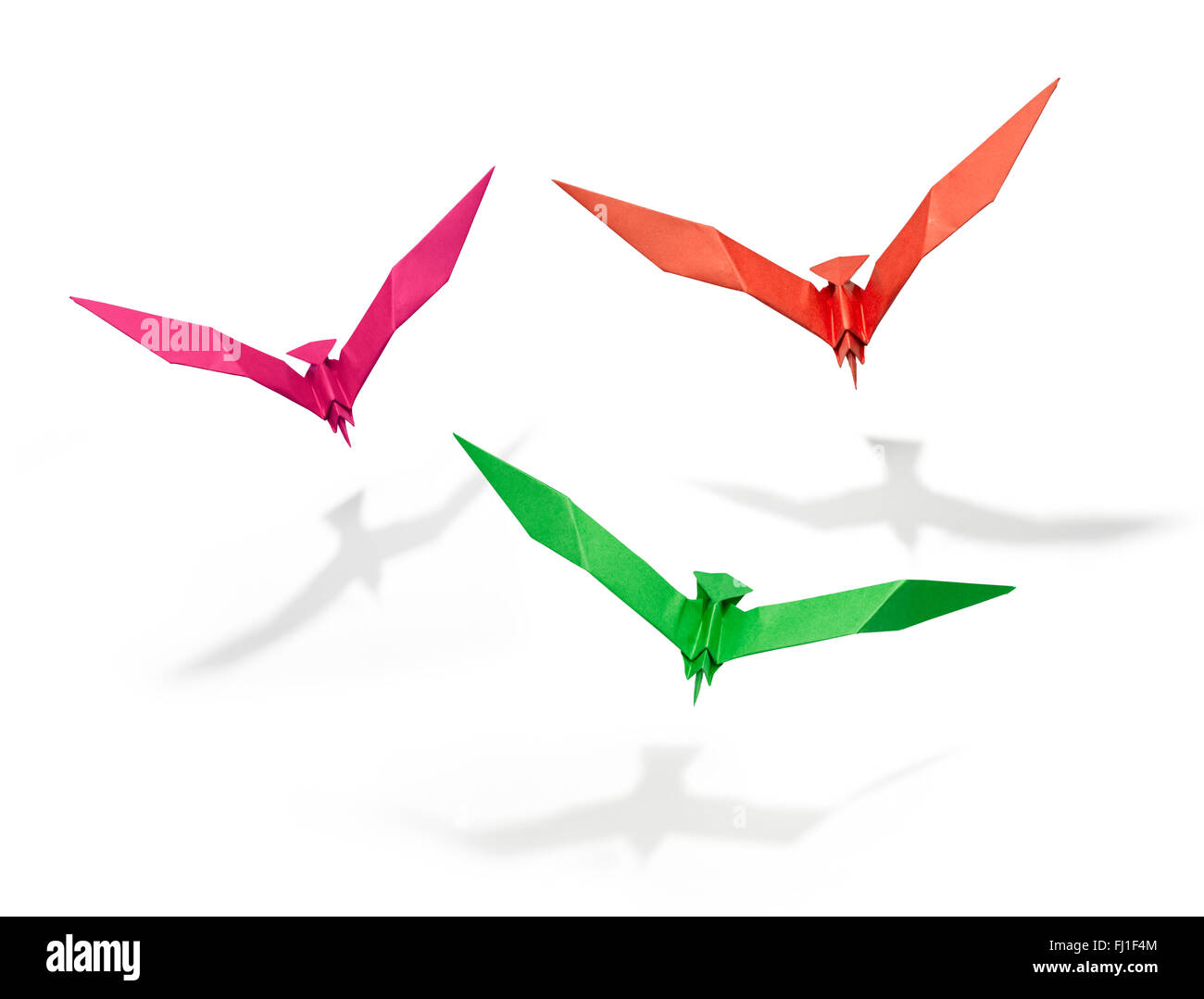 Group of three flying birds in Origami, there is a path for each bird. Stock Photo