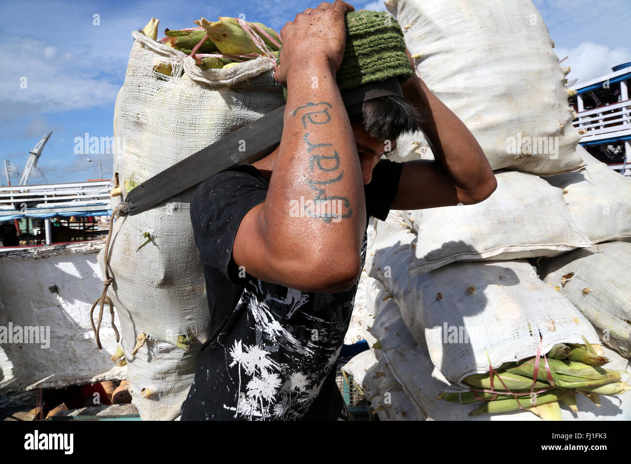 Man working at Manaus harbor, Amazon, Brazil Stock Photo