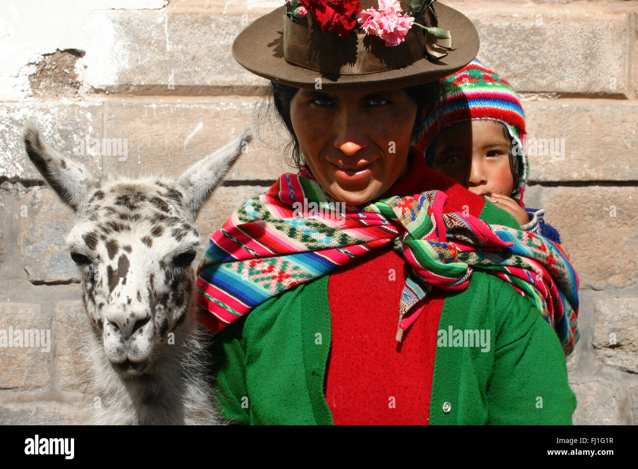 Portrait of Peruvian woman with traditional outfit and bowler hat , Peru Stock Photo