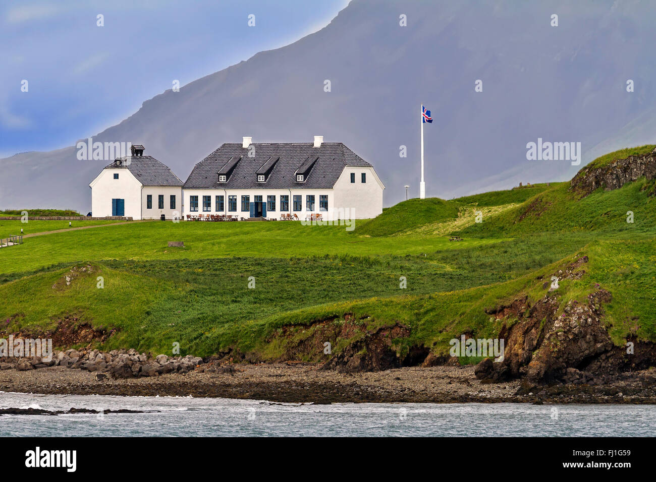 Buildings In Front Of Cliff Face Reykjavik Iceland Stock Photo