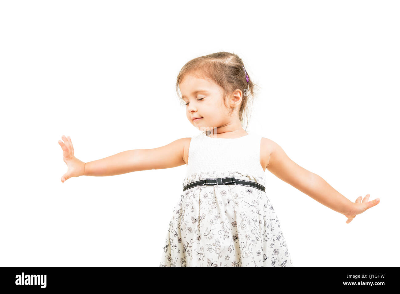 Cute little girl dancing with closed eyes isolated Stock Photo Alamy