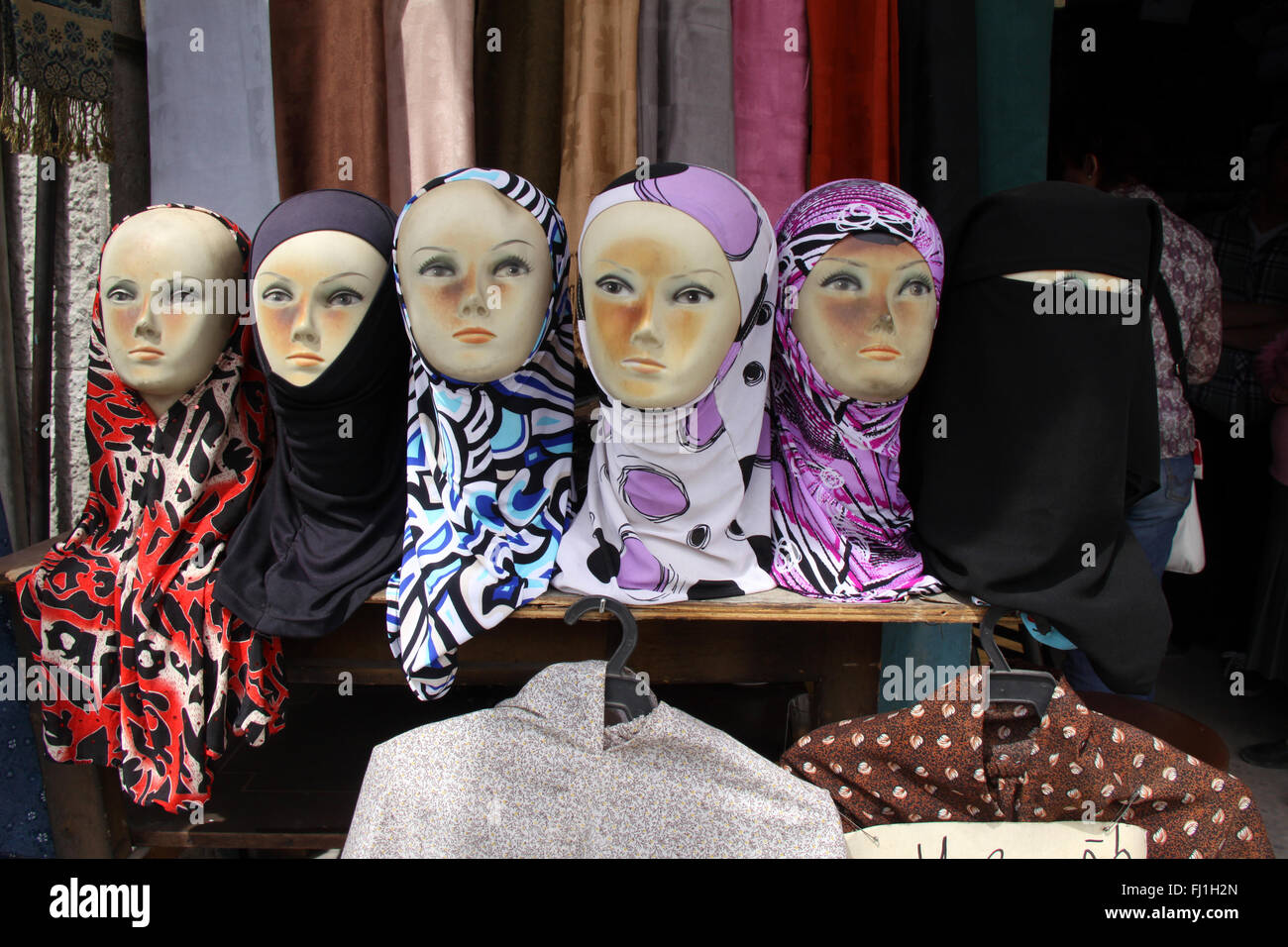 Islamic veils seller in the streets of Amman, Jordan Stock Photo