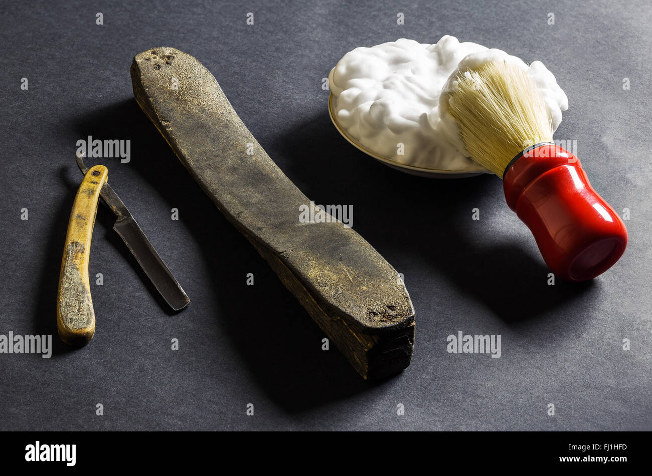 Old Money Razor Old razor with sharpening leather, brush and foam Stock Photo - Alamy