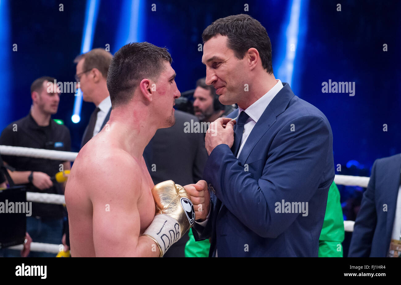 Halle, Germany. 27th Feb, 2016. Marco Huck (L, Germany) stands in the ring with Wladimir Klitschko after his victory against Ola Afolabi (Great Britain) during the cruiserweight boxing match at the IBO World Championships in Halle, Germany, 27 February 2016. Marco Huck won in the 10th round. Photo: GUIDO KIRCHNER/dpa/Alamy Live News Stock Photo