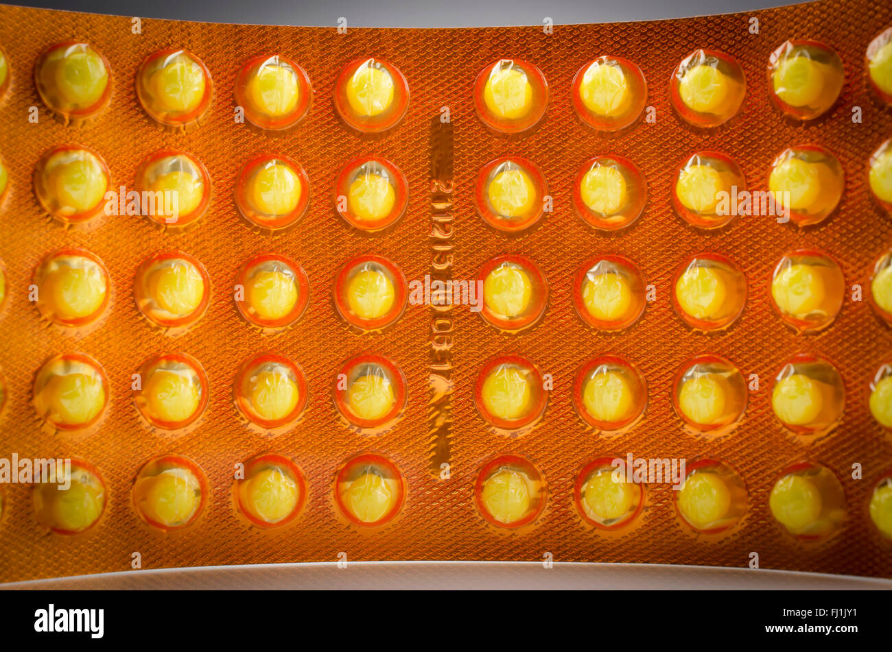 Pack of yellow tablets Stock Photo Alamy