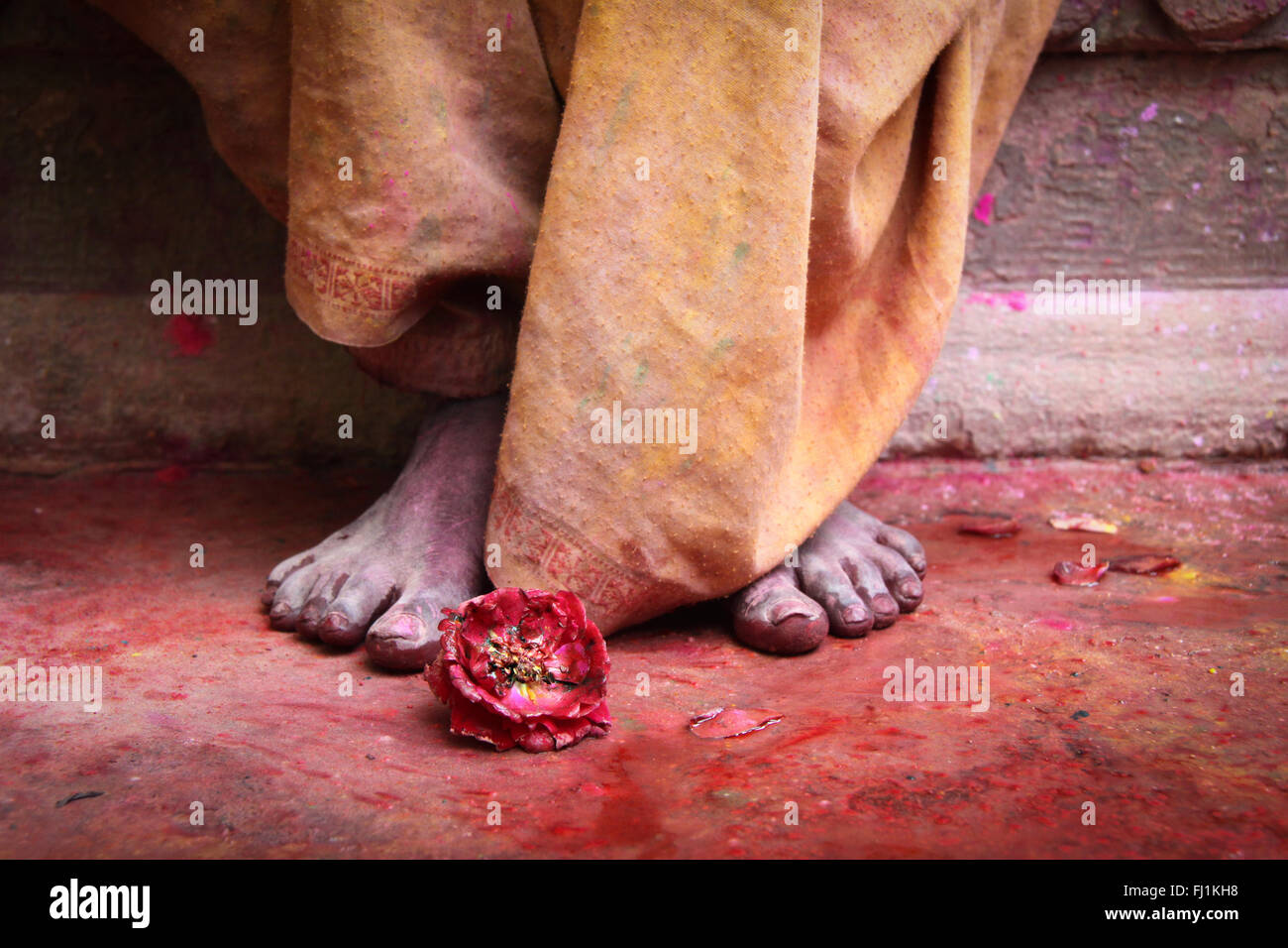 Colored feet during India Holi festival in Vrindavan Stock Photo