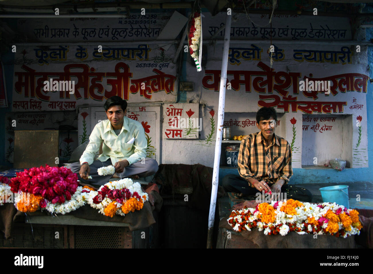 Men selling flowers in a street of Jodhpur, India Stock Photo
