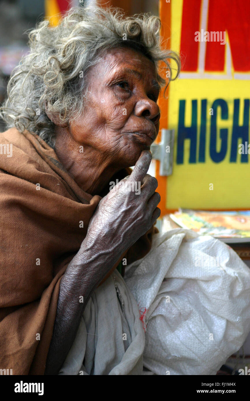 Woman beggar in a street of Delhi , India Stock Photo