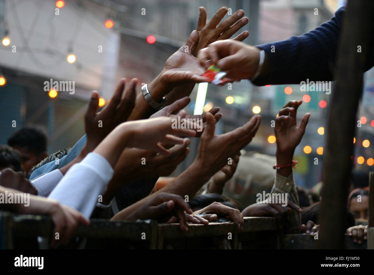 Hands and food distribution ina street of Delhi, India Stock Photo Alamy