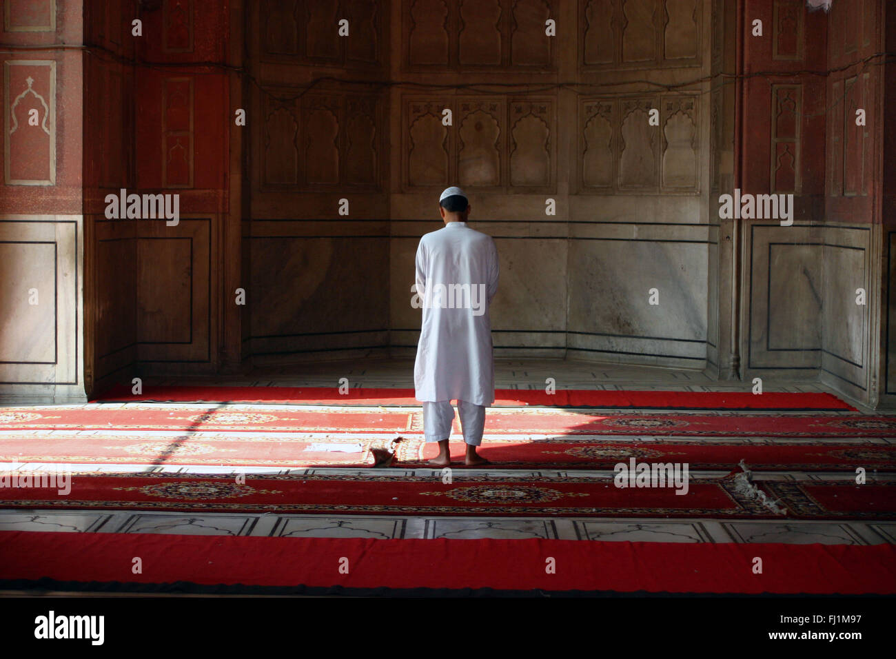 Man praying at Jama masjid, Delhi, India Stock Photo