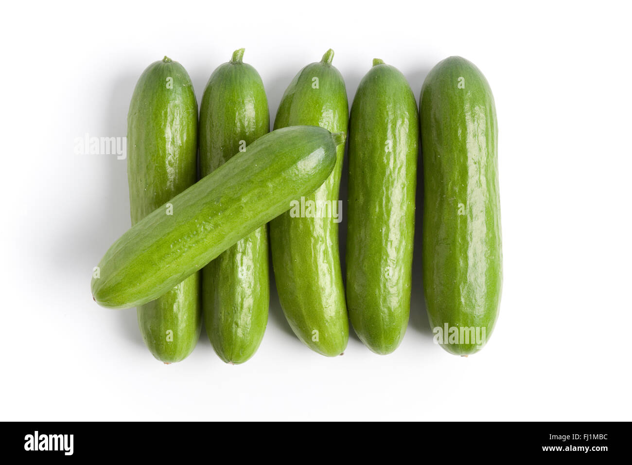 Fresh Raw Mini Cucumber Isolated On White Stock Photo - Download