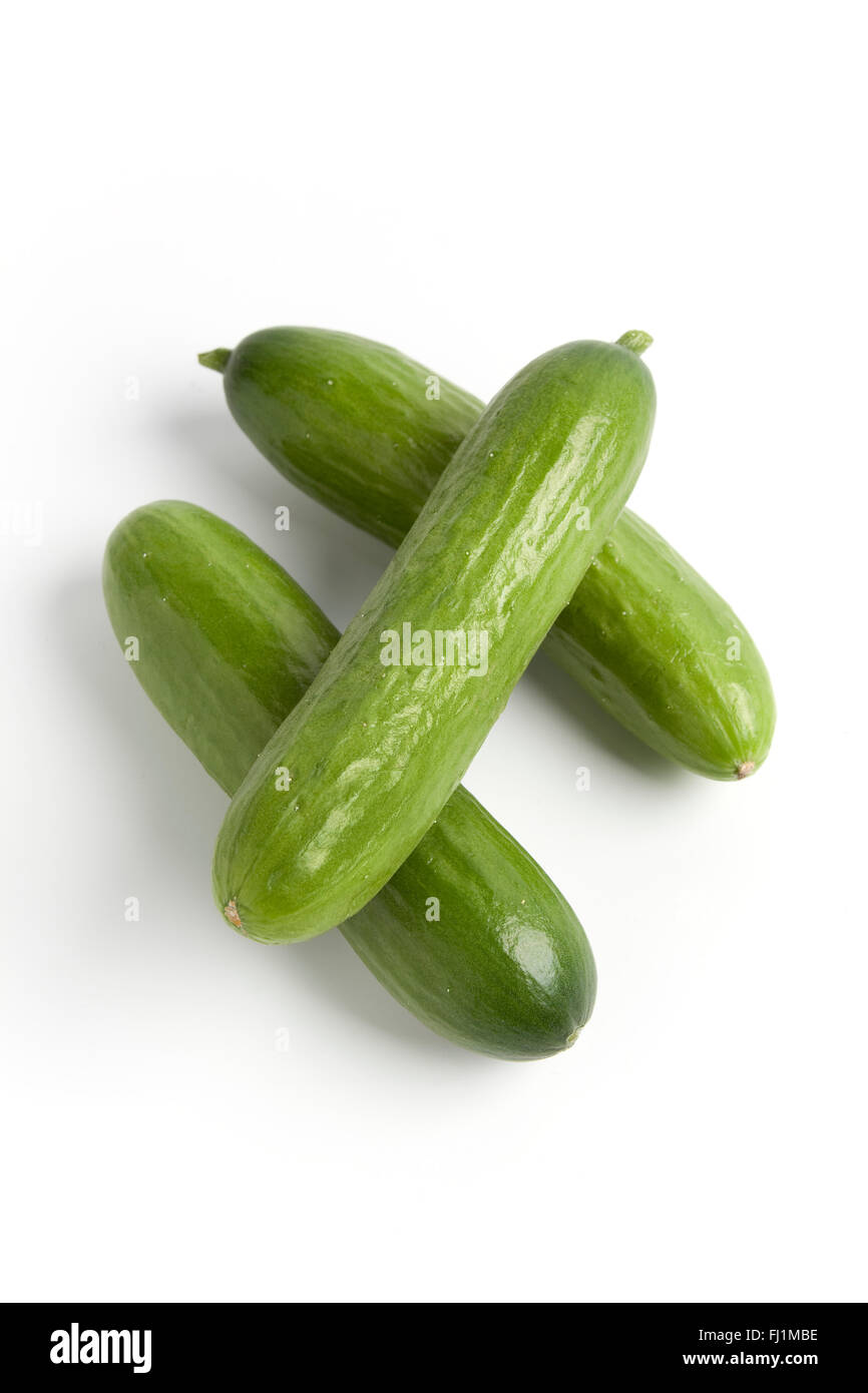 Fresh raw mini cucumbers on white background Stock Photo Alamy